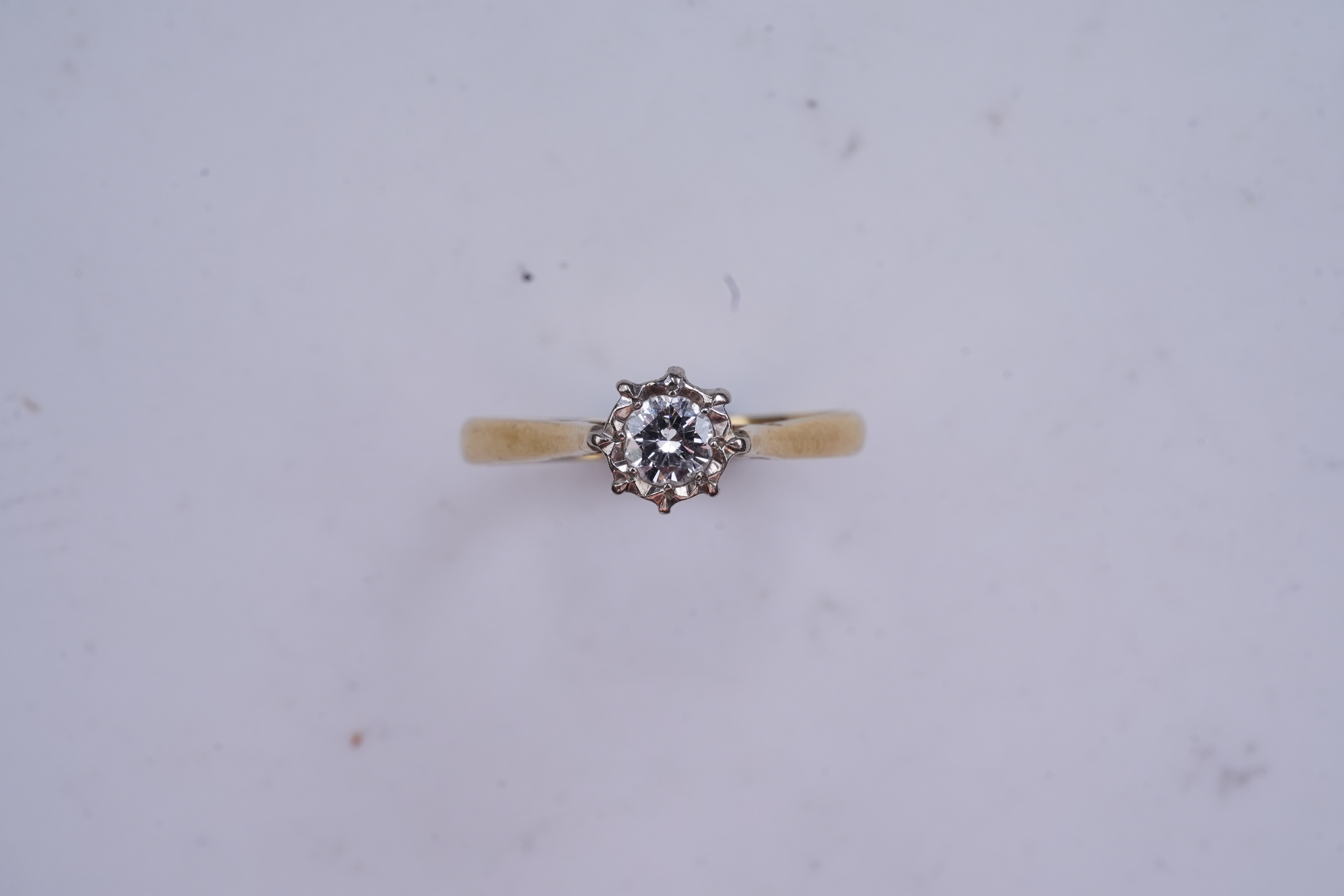 A diamond solitaire ring